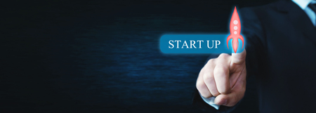 Hand touching transparent rocket icon. Startup conceptの写真素材