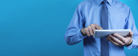 Businessman using white digital tablet. Concept of new technologyの写真素材