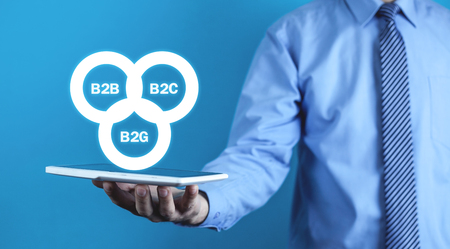 Businessman holding B2B, B2C, B2G business models. Business conceptの写真素材