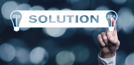 Hand touching a light bulb. Concept of Idea and Business Solutionの写真素材