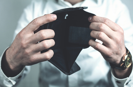 Caucasian businessman showing empty wallet.の写真素材