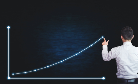 Businessman touching on financial chart. Growth conceptの写真素材