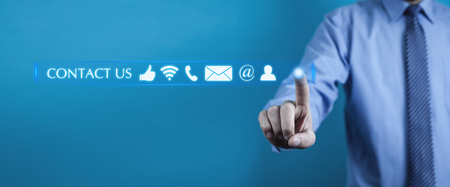 Man pressing contact us buttons. Customer support conceptの写真素材