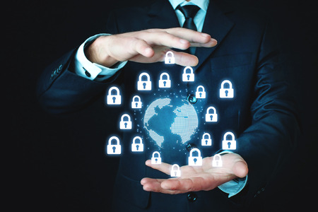 Man protect globe and padlocks. World secure conceptの写真素材