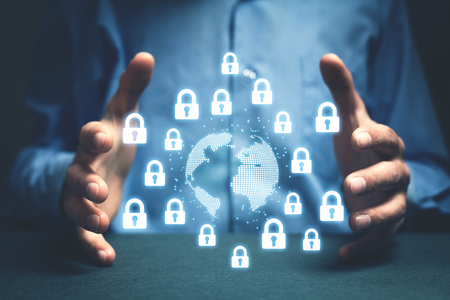 Man protect globe and padlocks. World secure conceptの写真素材