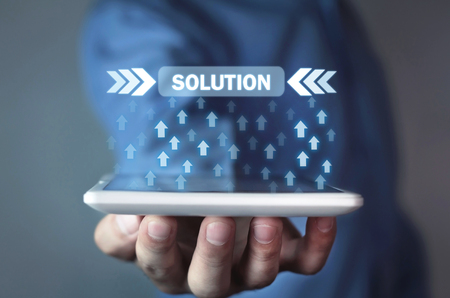 Man holding arrows with Solution button. Business conceptの写真素材