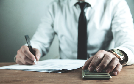 Businessman using calculator. Financial business calculationの写真素材