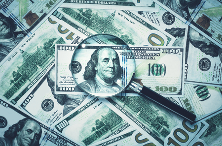 Magnifying glass and dollars. Business conceptの写真素材