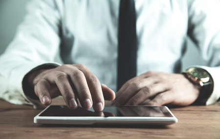 Man using white digital tablet. Business conceptの写真素材