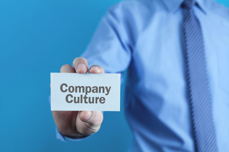 Businessman showing Company Culture word on business card.の写真素材