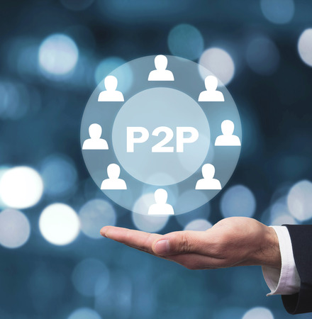 Hand holding P2P word with people icon. Concept of peer to peer P2Pの写真素材