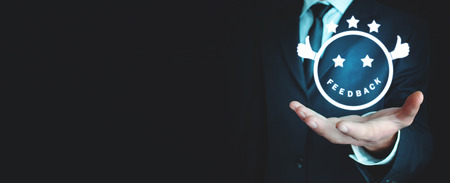 Man holding smiley. Feedback, Business conceptの写真素材