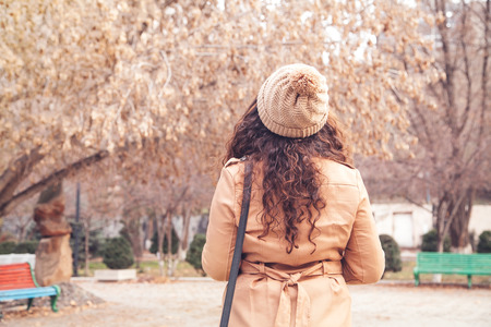 Caucasian girl in a autumn park.の写真素材