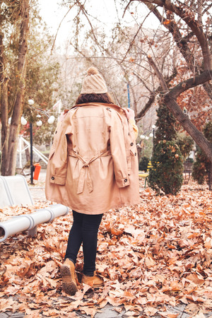Caucasian girl in a autumn park.の写真素材