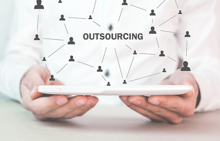 Man holding tablet. Outsourcing, business strategy conceptの写真素材