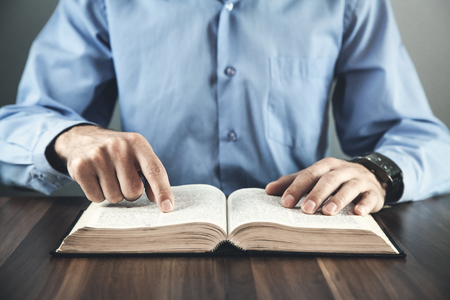 Caucasian businessman reading a book. Education conceptの写真素材