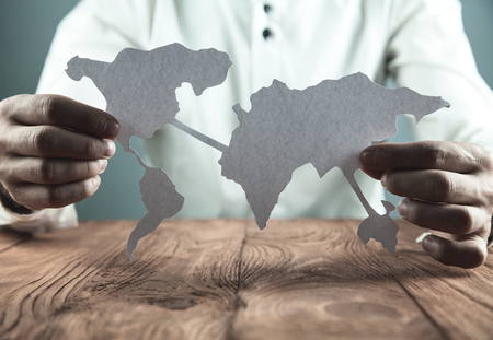 Businessman showing paper world map. Business conceptの写真素材