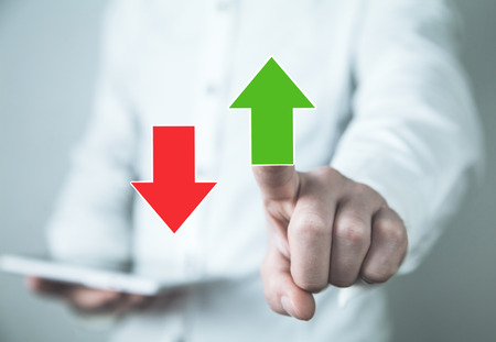 Man touching green arrow. Business growth and successの写真素材