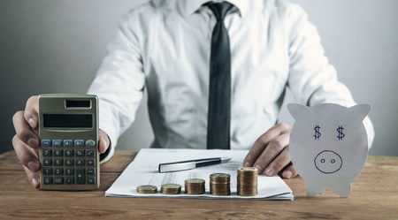 Man holding calculator. Business conceptの写真素材