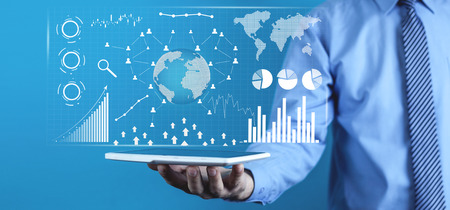 Man holding digital tablet. Financial statistics, business graphs, social network and connection. Future and finance conceptの写真素材