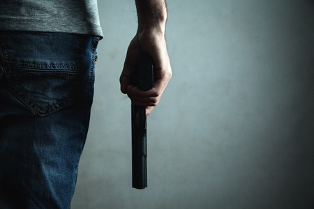 Man holding pistol. Criminal conceptの写真素材
