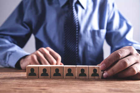 Man holding wooden cube. Human Resources Concept. Team Buildingの写真素材