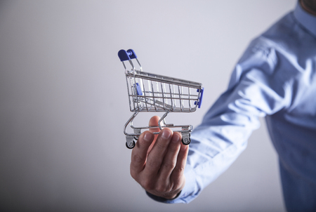 Man holding shopping cart. Shopping conceptの写真素材
