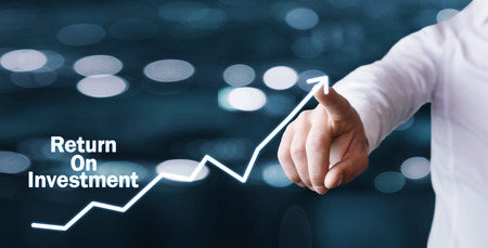 Man hand touching on arrow. Return On Investment. Business conceptの写真素材