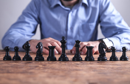 Man playing chess. Competition strategy conceptの写真素材