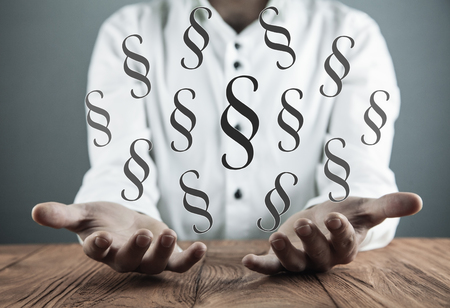 Man holding Paragraph symbols. Lawの写真素材