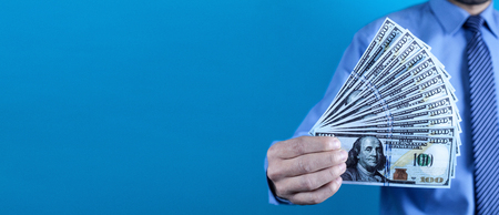 Caucasian businessman showing money.の写真素材