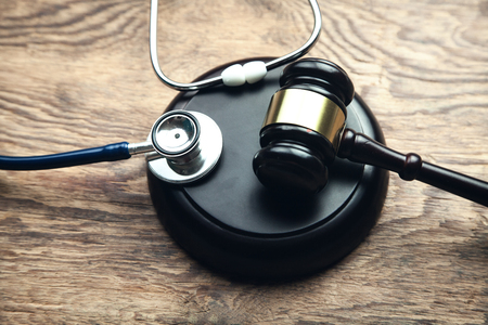 Judge gavel with stethoscope. Medical lawの写真素材