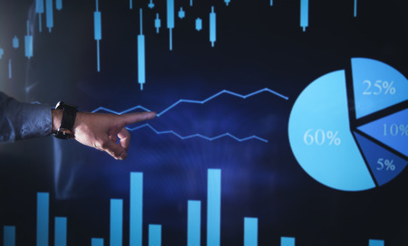 Hand pointing on stock market chart. Business growth, Investment