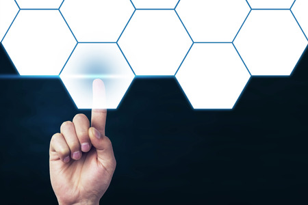Man hand touching blank hexagon. Business and Technology