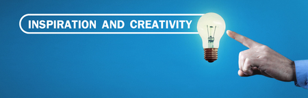Man hand touching light bulb. Inspiration and Creativity