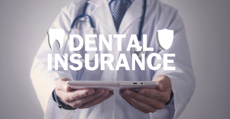 Doctor holding Dental Insurance text.の写真素材