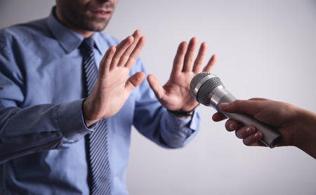 Businessman doing stop gesture. Reporterの写真素材