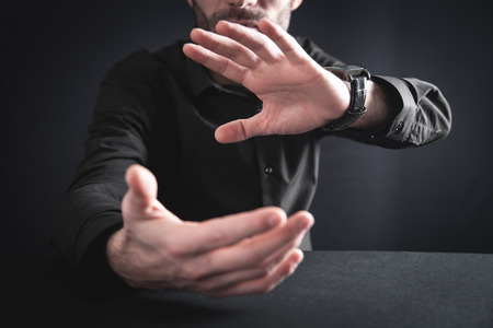 Man with protecting hands. Protecting gesture