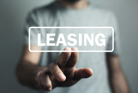 Man hand touch in Leasing text. Businessの写真素材