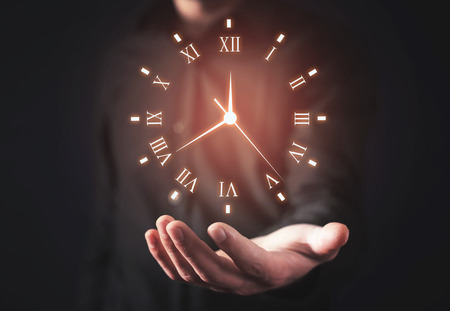 Man holding clock. Business time management の写真素材