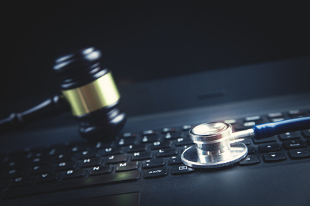 Stethoscope on laptop keyboard. Concept of medical technology networkの写真素材