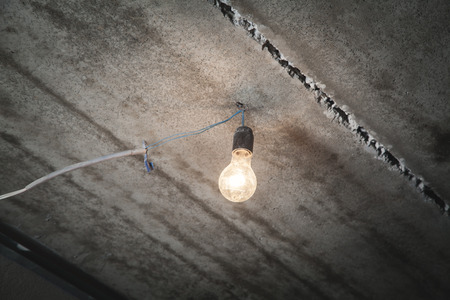Light bulb from the ceiling. Powerの写真素材