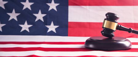Judge gavel with American flag.の写真素材