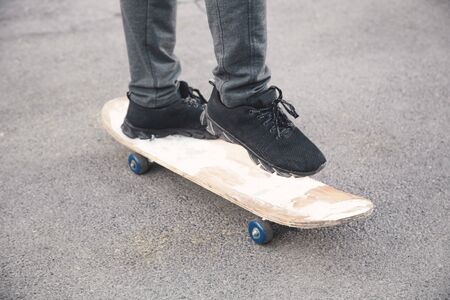 Boy rides on skateboard in the asphalt.の写真素材