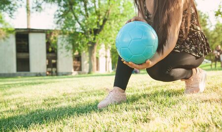 Woman soccer player holding soccer ball.の写真素材