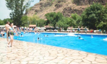 Defocused view. People in the swimming poolの写真素材