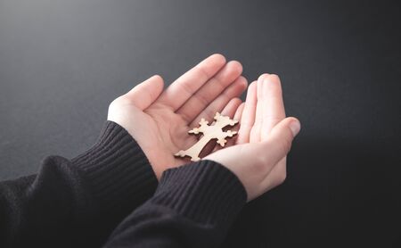 Hands holding cross. Religion conceptの写真素材