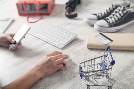 Hand using smartphone. Online payment. Shopping concept