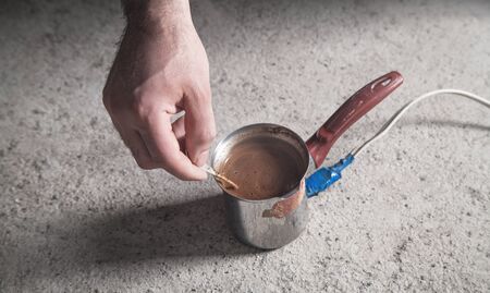 Caucasian man preparing fresh coffee.の写真素材
