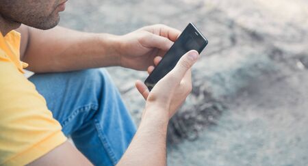 Young man using smartphone. Technology and communication